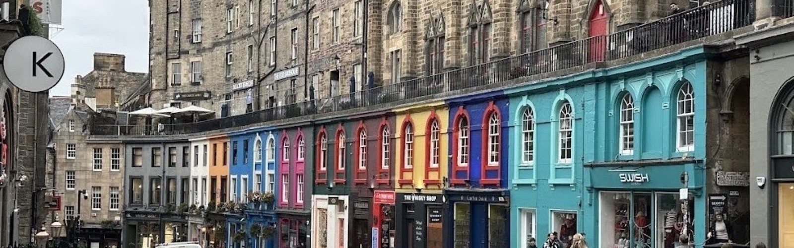 Colorful buildings on a cobblestone street 